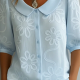 Milena | Elegantna bluza sa cvetnim detaljem