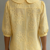 Milena | Elegantna bluza sa cvetnim detaljem